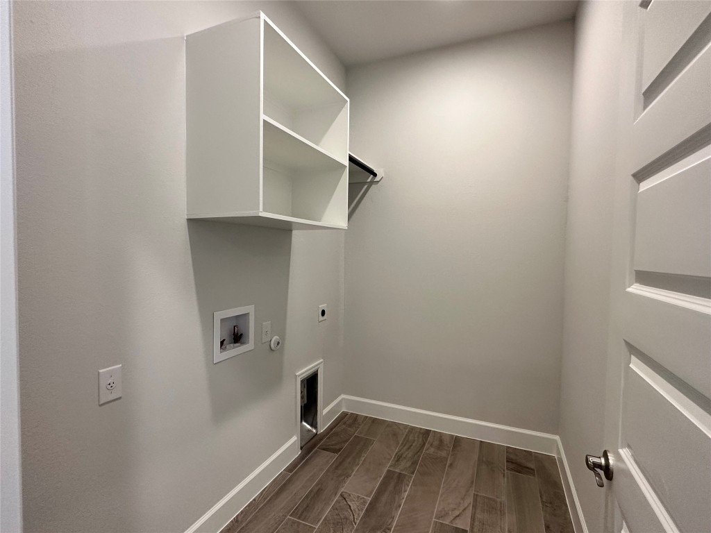 17309 Cain Clearing Pass Austin, TX 78738 - Photo 25 of 33 Enclosed laundry room with built-in shelves