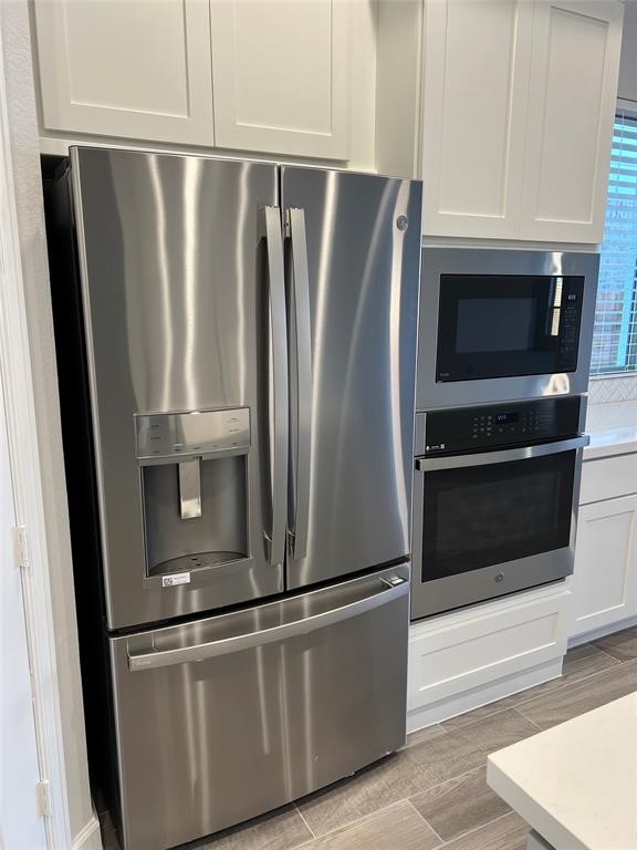 17309 Cain Clearing Pass Austin, TX 78738 - Photo 9 of 33 GE Profile fridge stays.