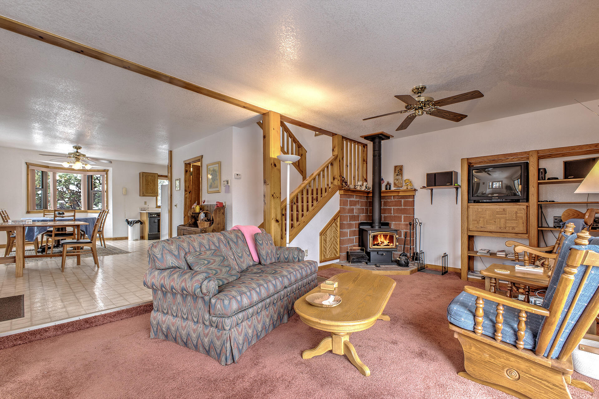 25006 Knob-Hill Idyllwild, CA 92549 - Photo 12 of 47 a living room with furniture a rug and a window
