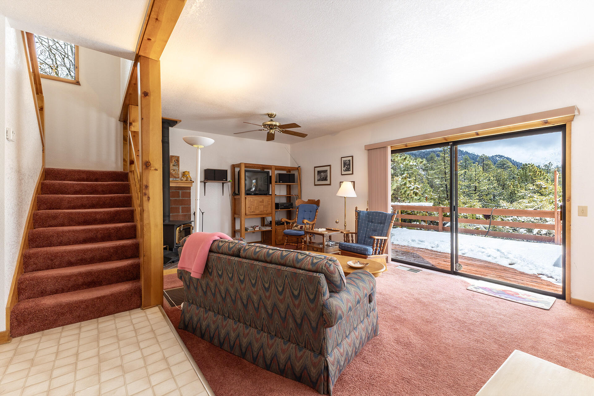 25006 Knob-Hill Idyllwild, CA 92549 - Photo 15 of 47 a living room with furniture and a floor to ceiling window