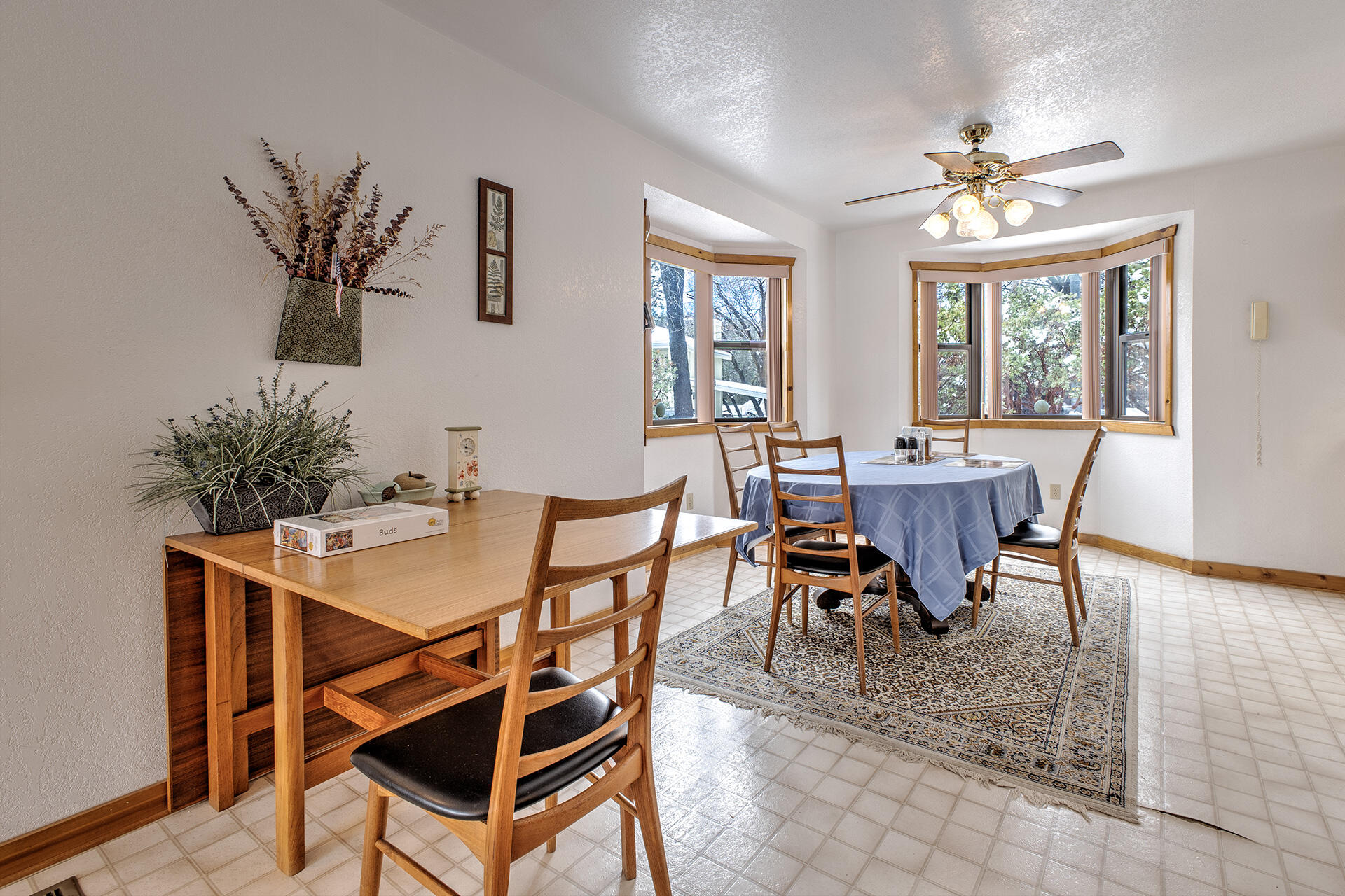 25006 Knob-Hill Idyllwild, CA 92549 - Photo 17 of 47 a view of a dining room with furniture window and wooden floor