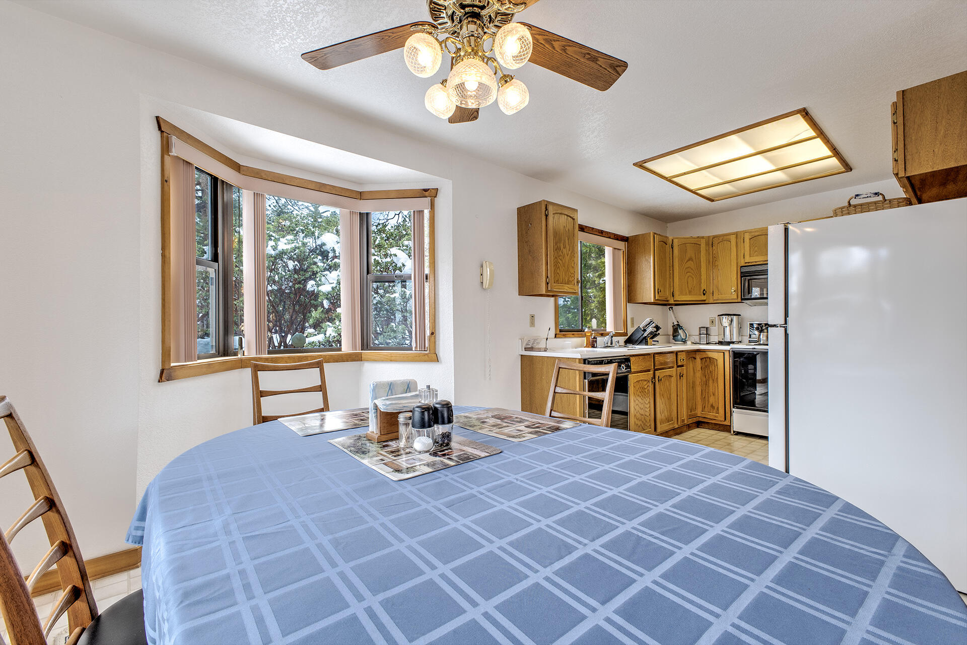 25006 Knob-Hill Idyllwild, CA 92549 - Photo 22 of 47 a living room with stainless steel appliances kitchen island granite countertop a dining table chairs sink and cabinets