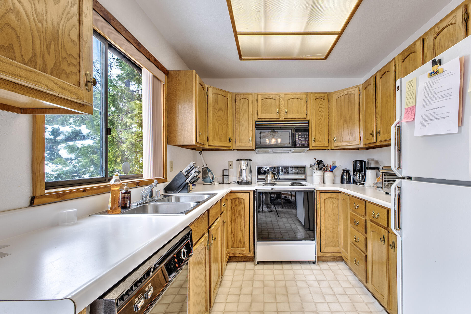 25006 Knob-Hill Idyllwild, CA 92549 - Photo 23 of 47 a kitchen with a sink appliances cabinets and a large window