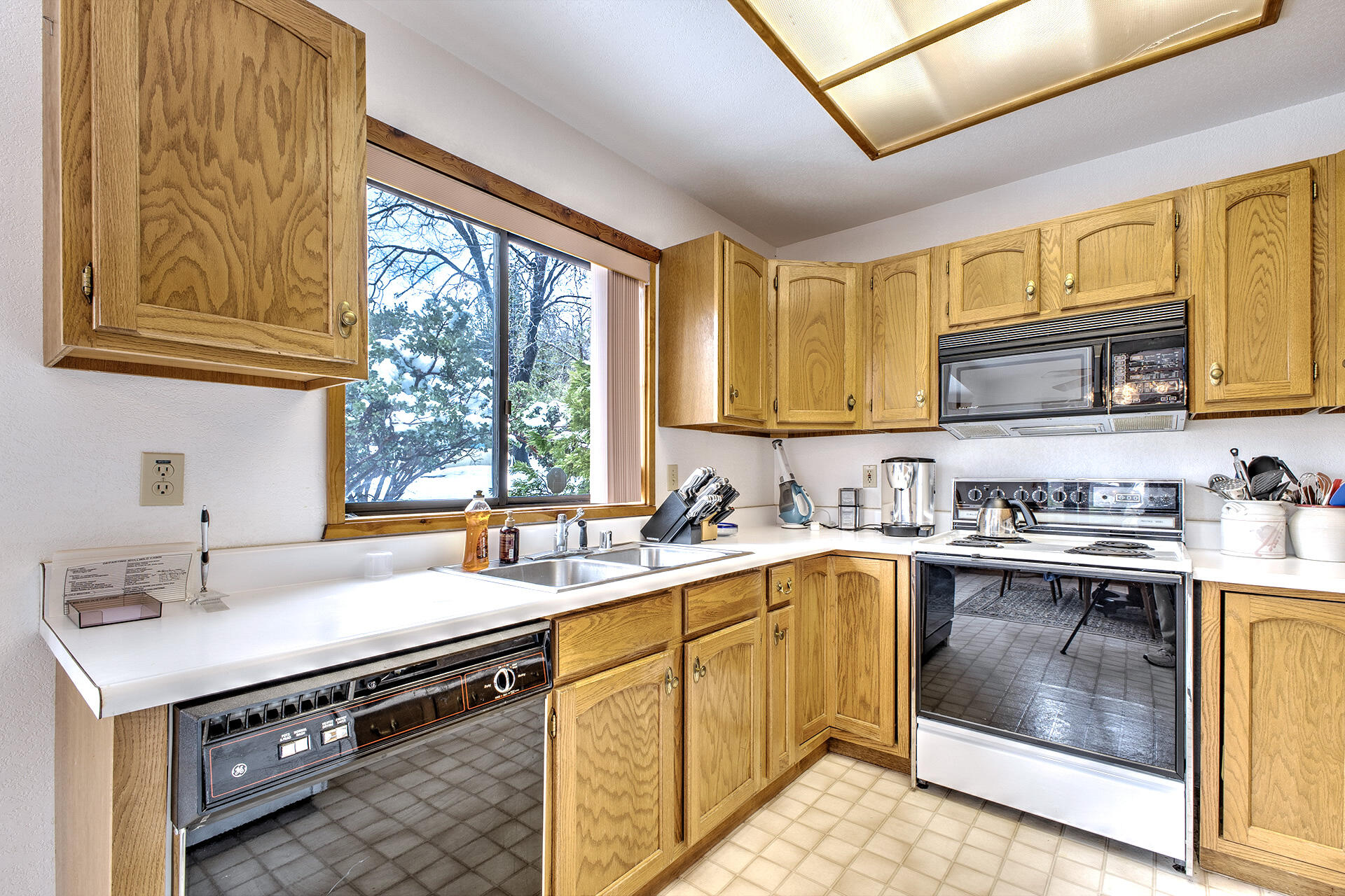 25006 Knob-Hill Idyllwild, CA 92549 - Photo 24 of 47 a kitchen with a sink stove top oven and cabinets