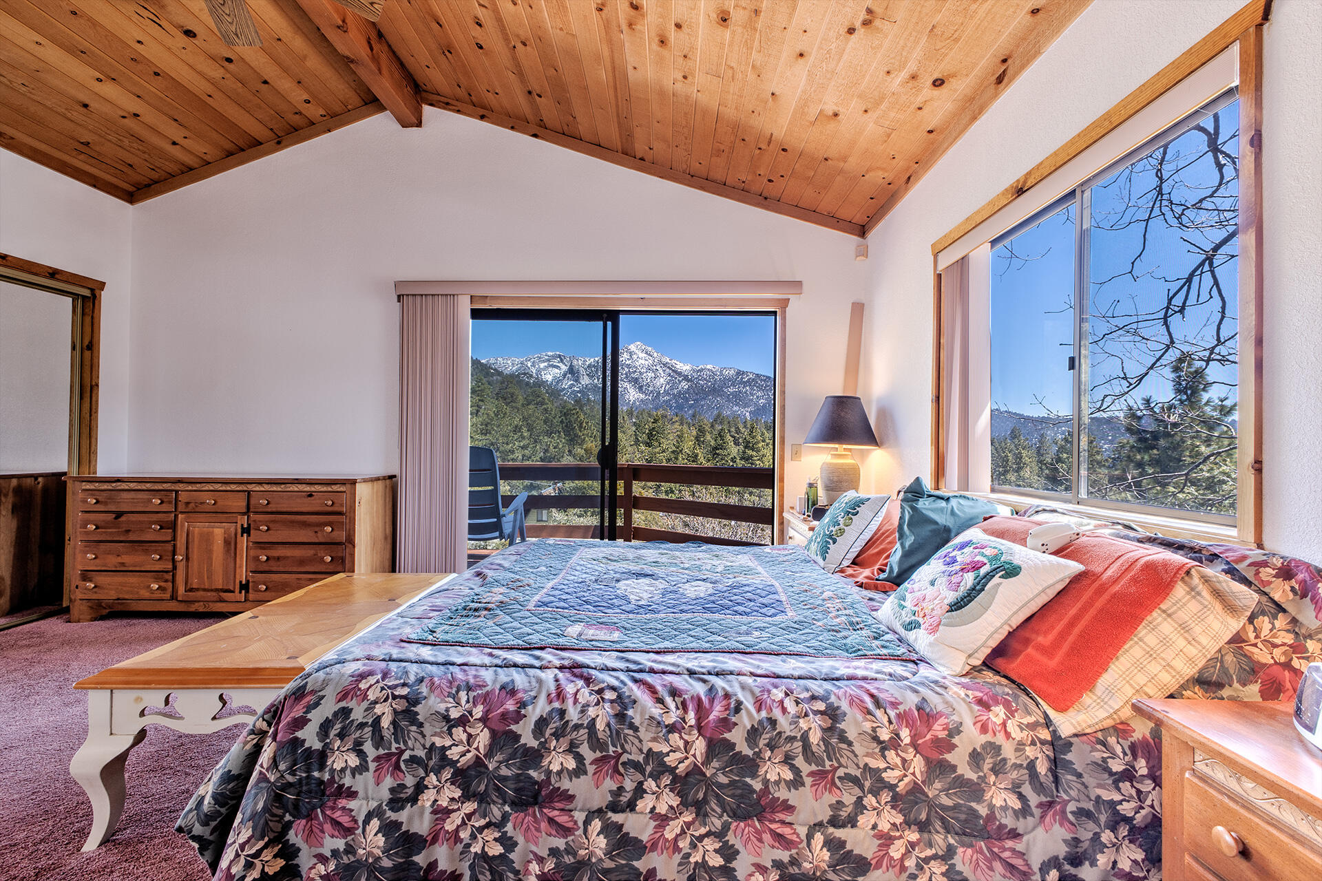 25006 Knob-Hill Idyllwild, CA 92549 - Photo 35 of 47 a bed sitting in a bedroom next to a window