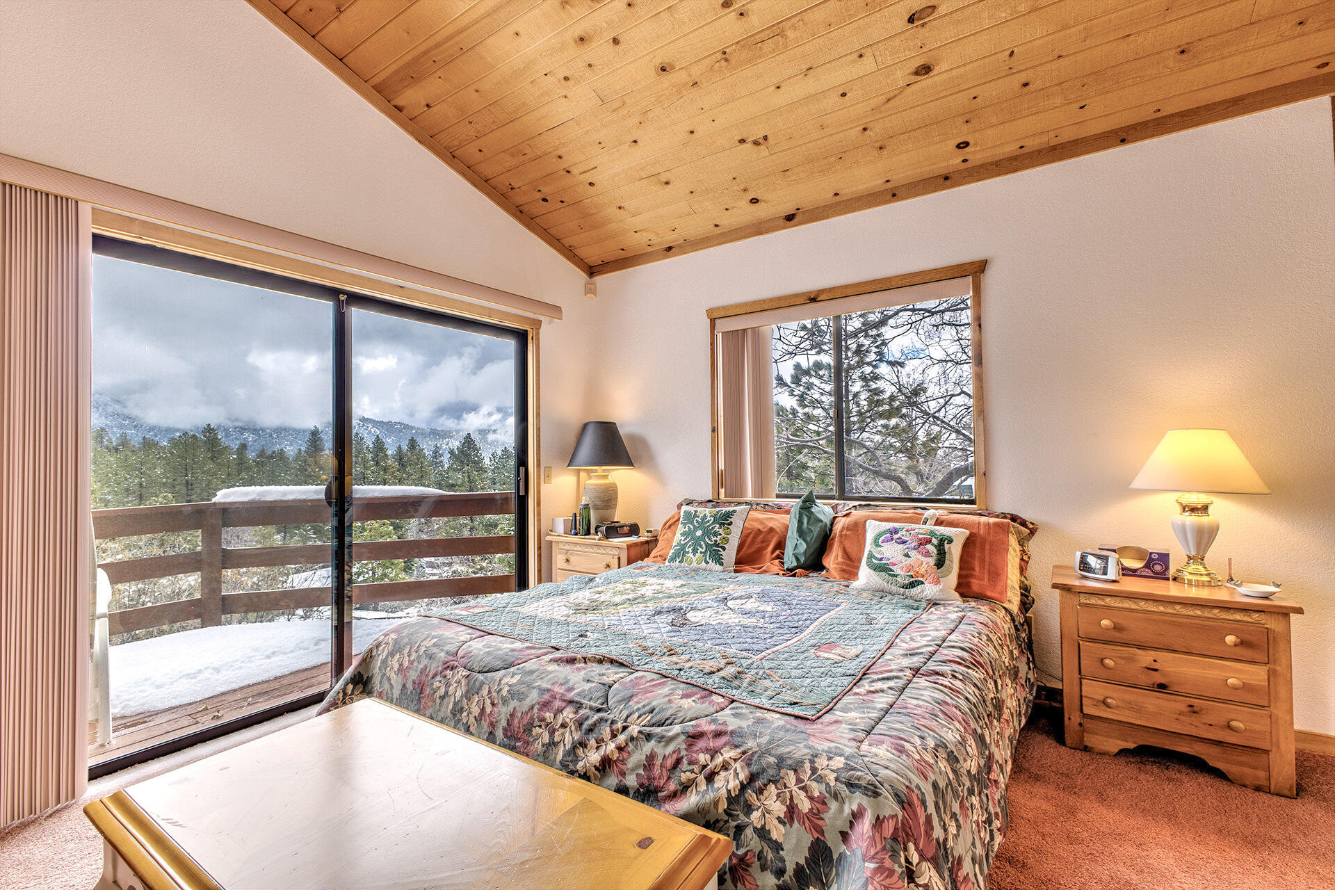 25006 Knob-Hill Idyllwild, CA 92549 - Photo 41 of 47 a bedroom with a bed and a large window