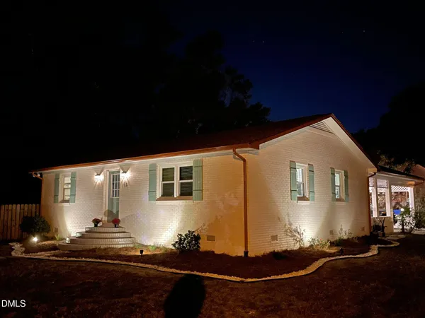 a lobby with furniture and potted plants