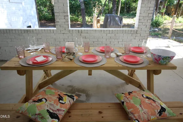 a view of a balcony with two chairs and a table