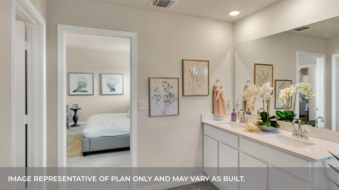 1908 Bandito Bluff Pass Leander, TX 78641 - Photo 26 of 29 a en suite bathroom with a double vanity sink and a mirror