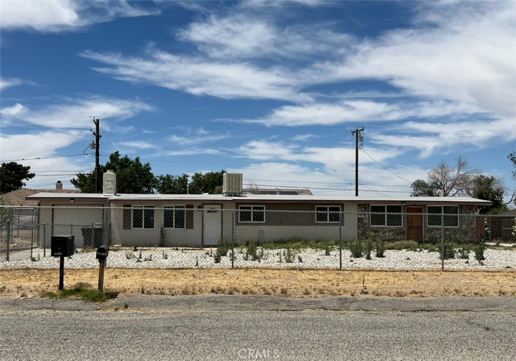 13122 El Rio Road Victorville, CA 92392 - Photo 1 of 1 a view of a house with a yard