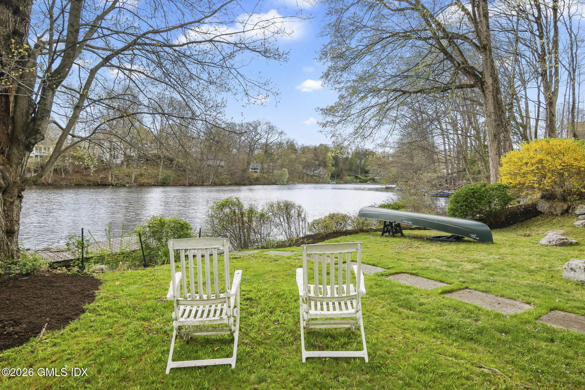 185 Valley Road Cos Cob, CT 06807 - Photo 34 of 38 a view of a lake with a garden and swimming pool