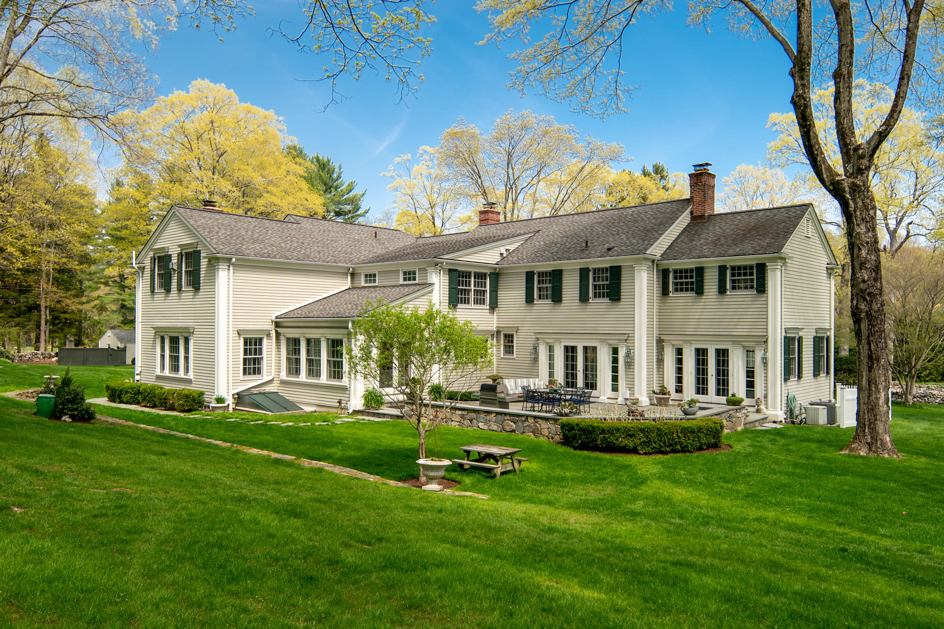 398 Valley Road New Canaan, CT 06840 - Photo 3 of 44 a front view of a house with a yard