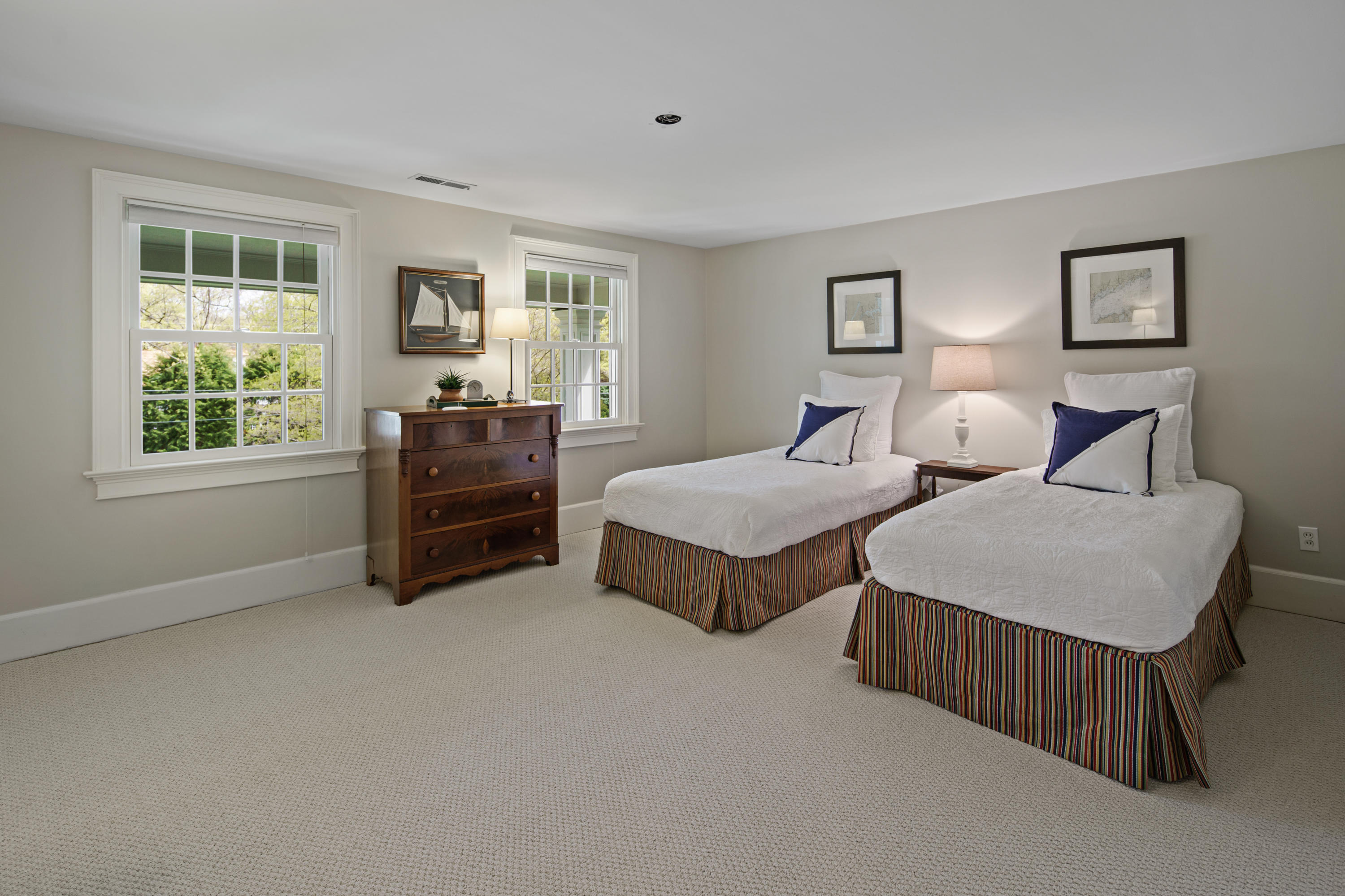 398 Valley Road New Canaan, CT 06840 - Photo 27 of 44 a spacious bedroom with two beds and a window