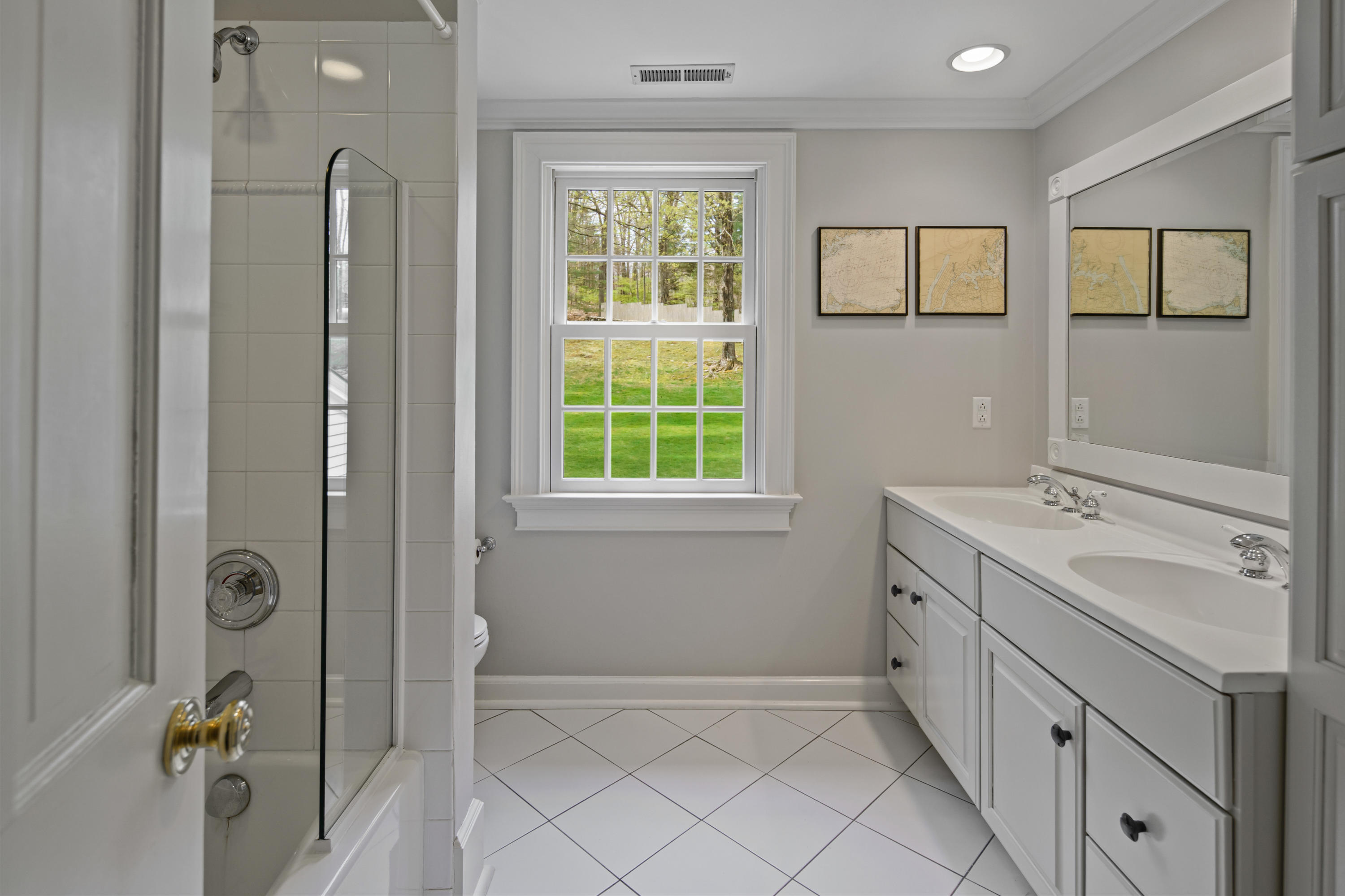 398 Valley Road New Canaan, CT 06840 - Photo 28 of 44 a bathroom with a double vanity sink toilet and shower