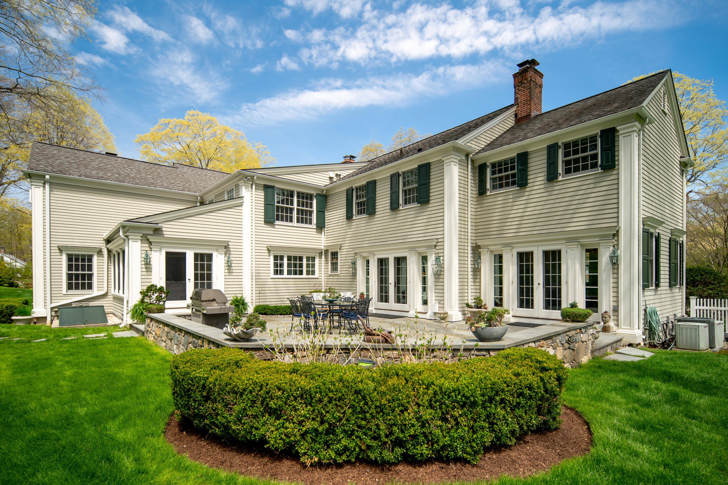 398 Valley Road New Canaan, CT 06840 - Photo 31 of 44 a front view of a house with swimming pool