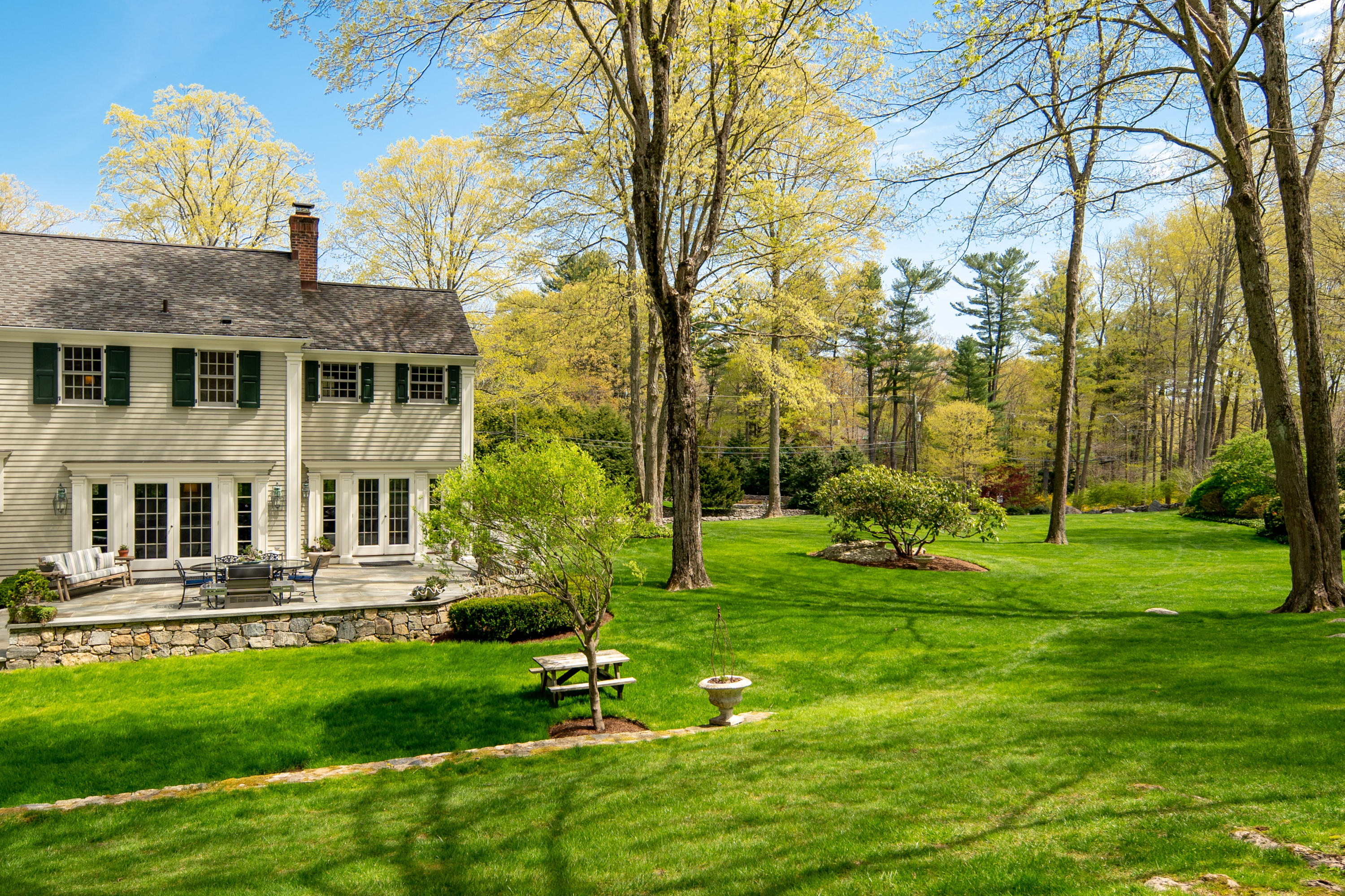 398 Valley Road New Canaan, CT 06840 - Photo 32 of 44 a front view of house with yard and green space