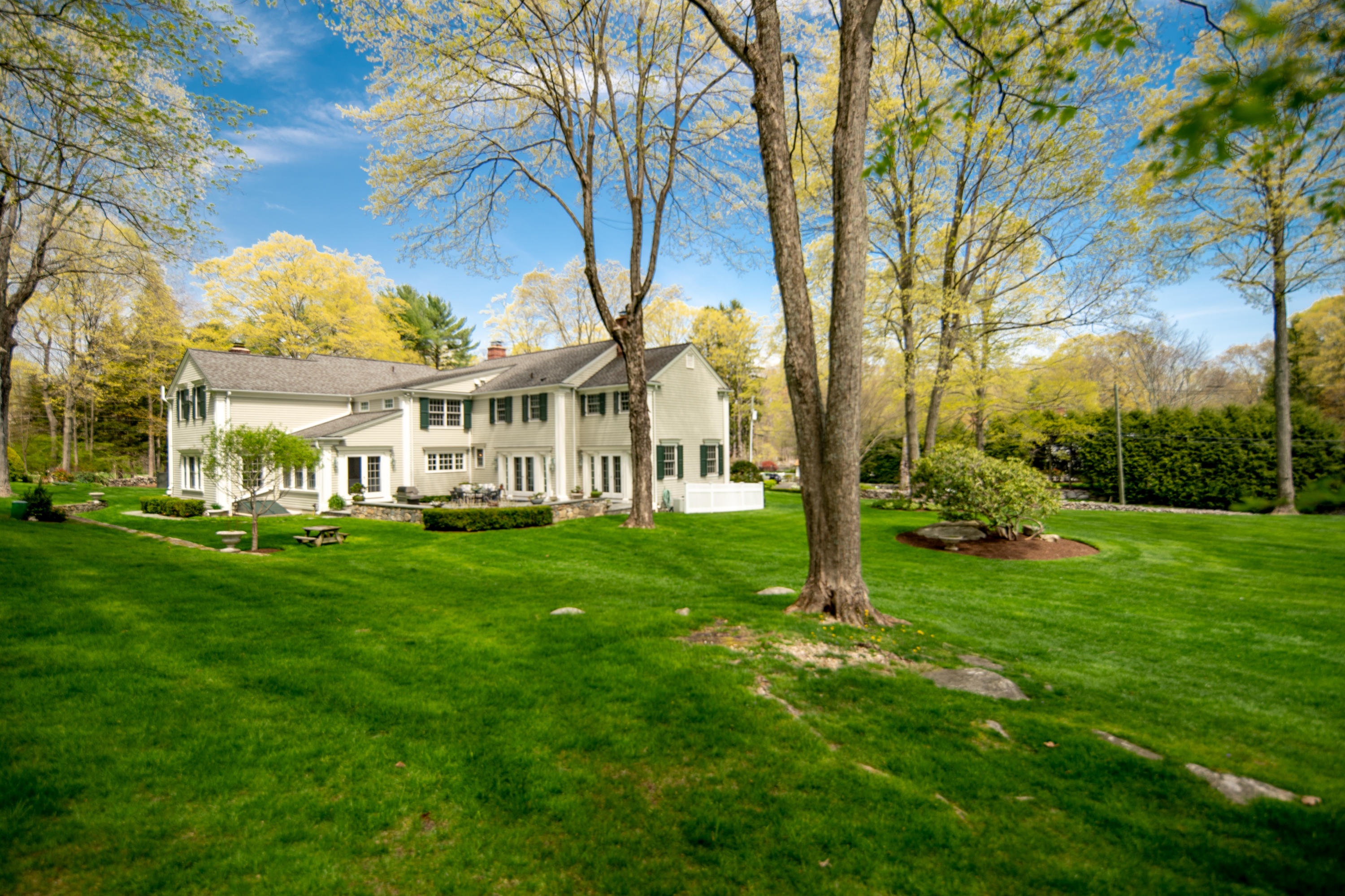 398 Valley Road New Canaan, CT 06840 - Photo 39 of 44 a view of an house with backyard and a tree