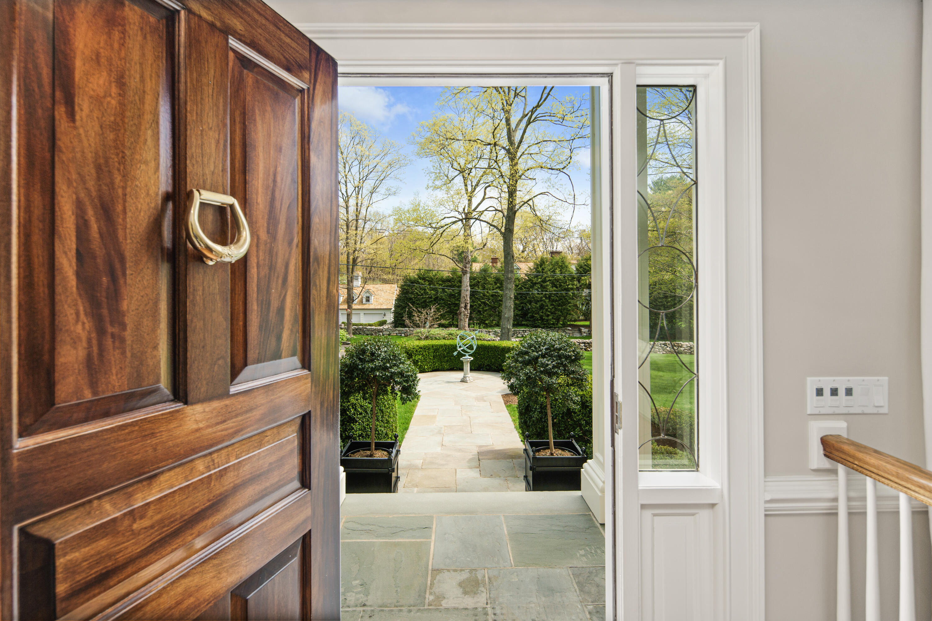 398 Valley Road New Canaan, CT 06840 - Photo 5 of 44 a front view of a house with a porch