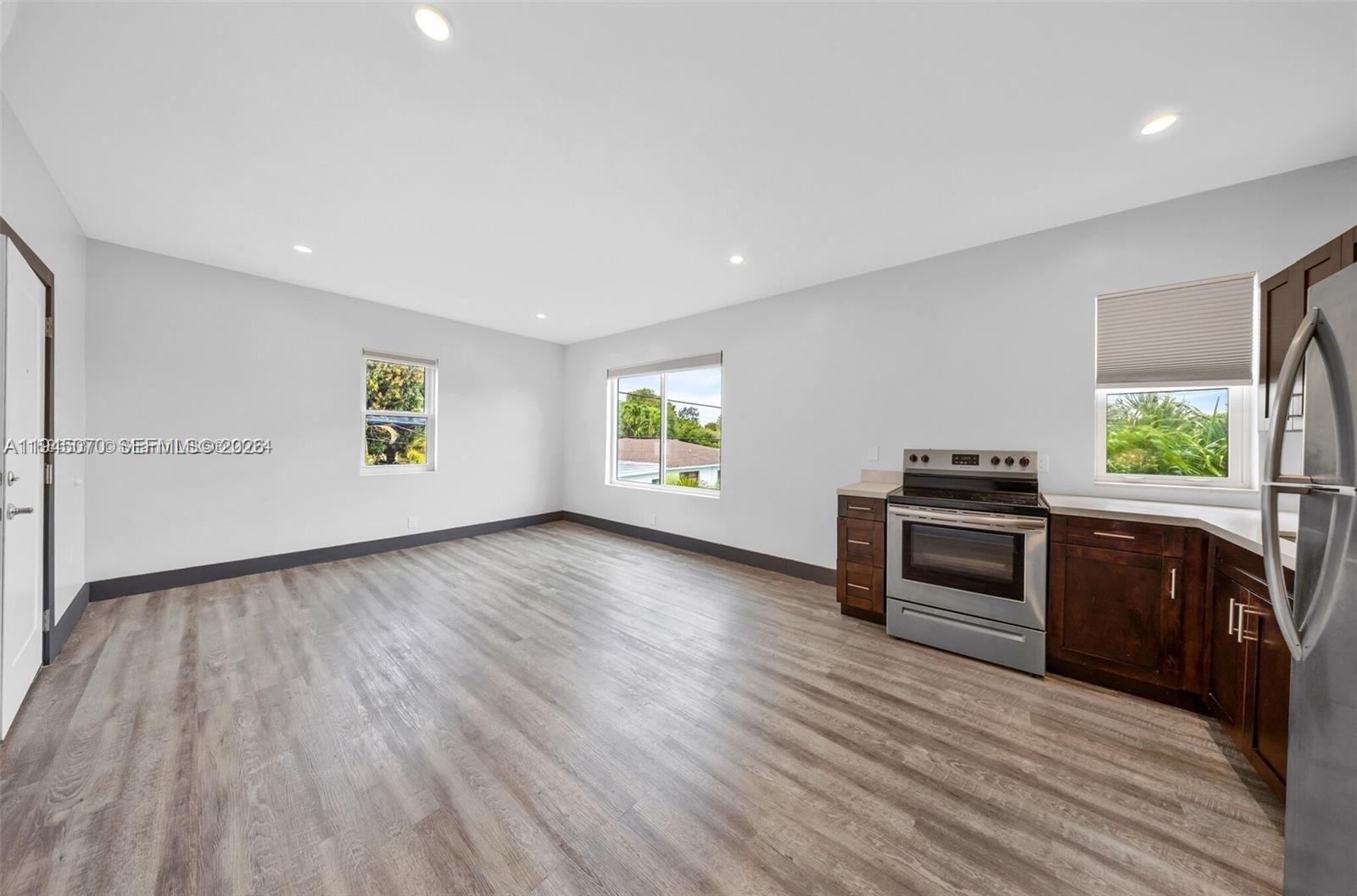 1020 Southwest 23rd Avenue, Unit 3 Miami, FL 33135 - Photo 1 of 15 a view of an empty room and window