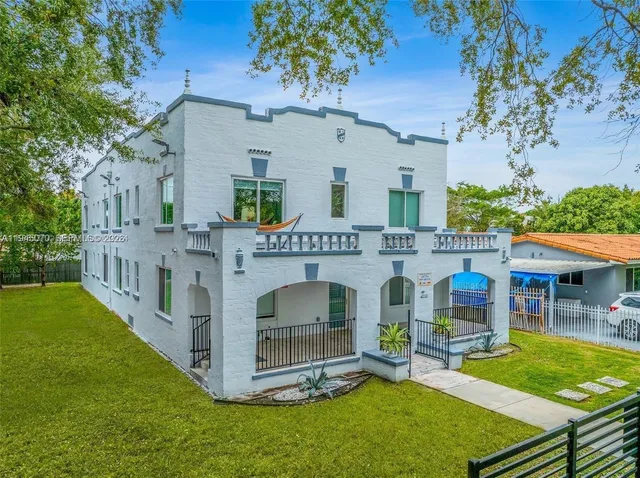 a view of a house with a yard porch and sitting area