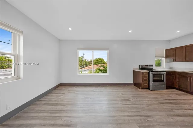 a view of kitchen with furniture and window