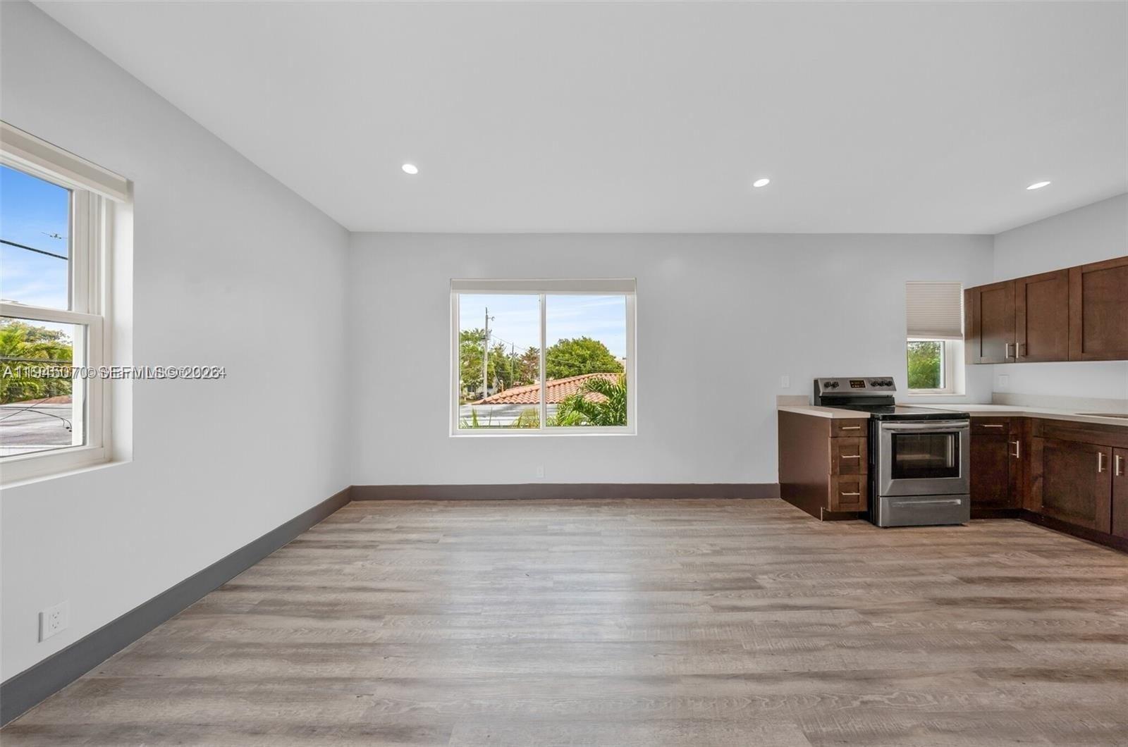 1020 Southwest 23rd Avenue, Unit 3 Miami, FL 33135 - Photo 2 of 15 a view of kitchen with furniture and window