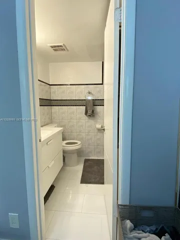 a bathroom with a toilet and a sink