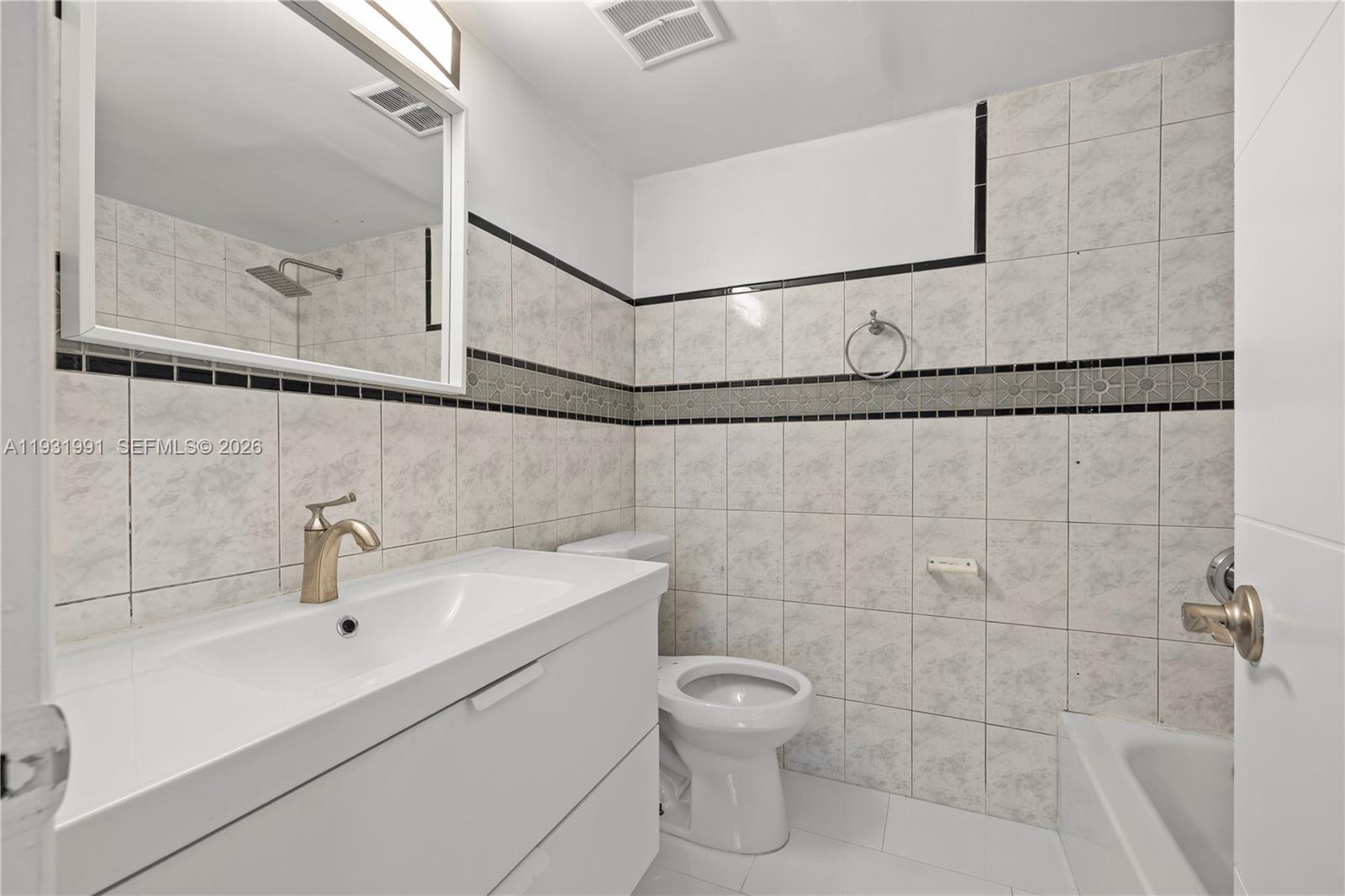 455 South Pine Island Road, Unit 307C Plantation, FL 33324 - Photo 15 of 30 a bathroom with a sink a toilet and shower