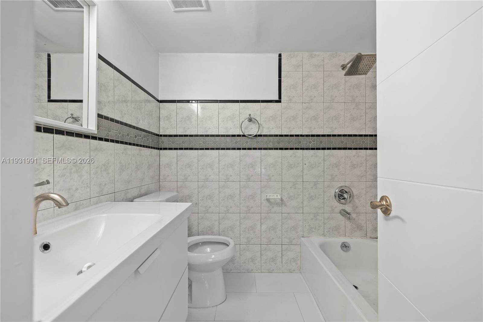 455 South Pine Island Road, Unit 307C Plantation, FL 33324 - Photo 16 of 30 a bathroom with a sink a toilet and shower