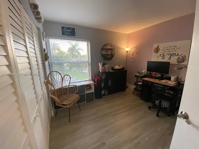 a room with furniture and a flat screen tv