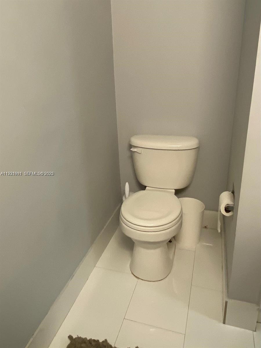 455 South Pine Island Road, Unit 307C Plantation, FL 33324 - Photo 3 of 17 a white toilet sitting next to a white wall