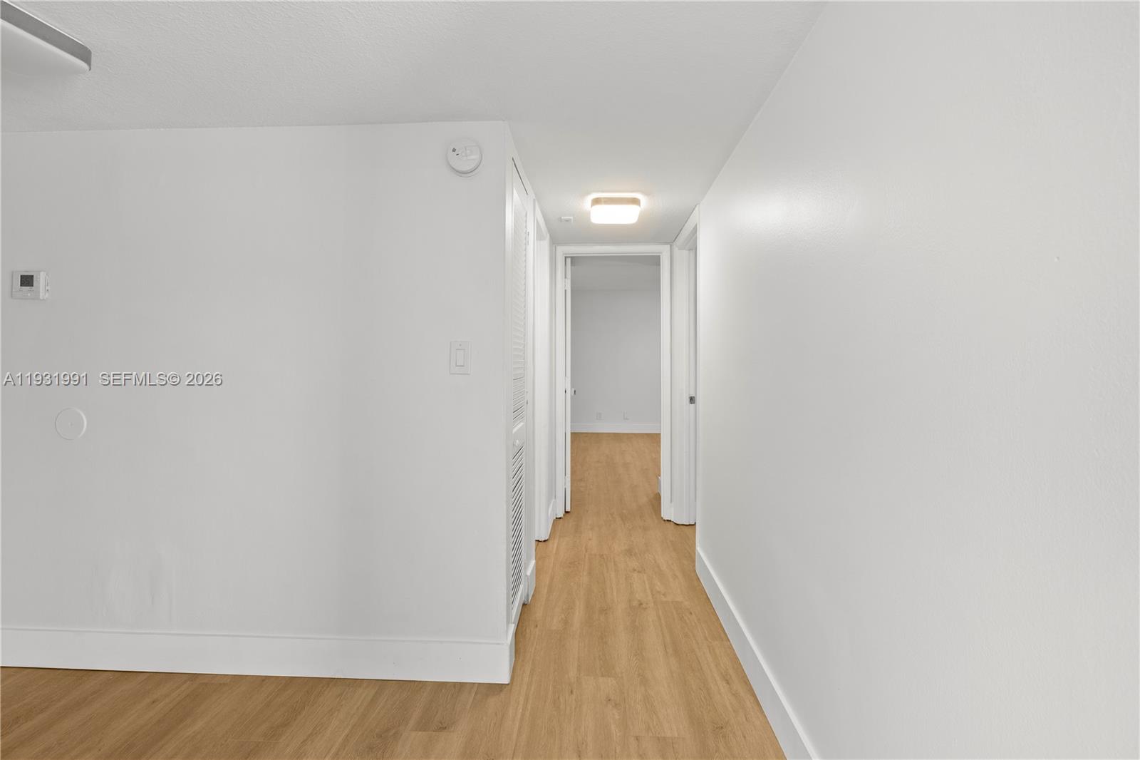 455 South Pine Island Road, Unit 307C Plantation, FL 33324 - Photo 5 of 30 a view of a hallway with wooden floor