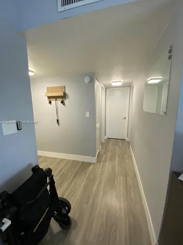 a view of a livingroom with wooden floor