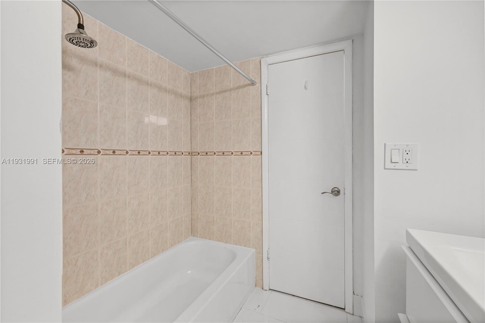 455 South Pine Island Road, Unit 307C Plantation, FL 33324 - Photo 8 of 30 a bathroom with a bathtub and a shower