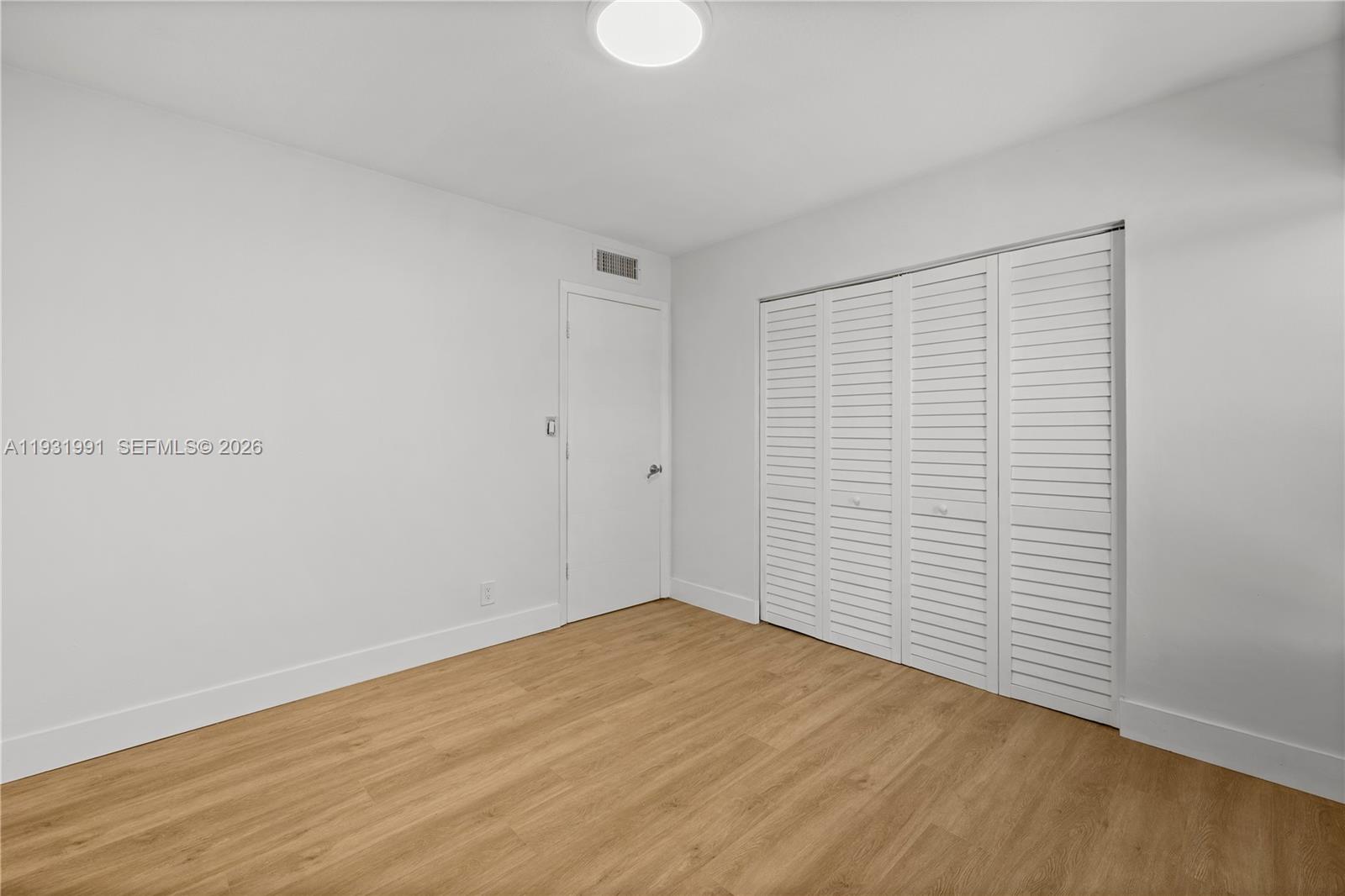 455 South Pine Island Road, Unit 307C Plantation, FL 33324 - Photo 10 of 30 a view of empty room with wooden floor