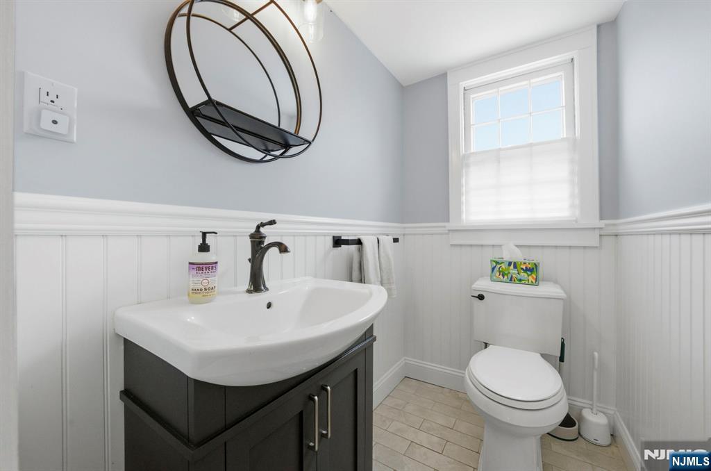 18 Laura Lane Park Ridge, NJ 07656 - Photo 14 of 36 a bathroom with a sink a toilet and a mirror
