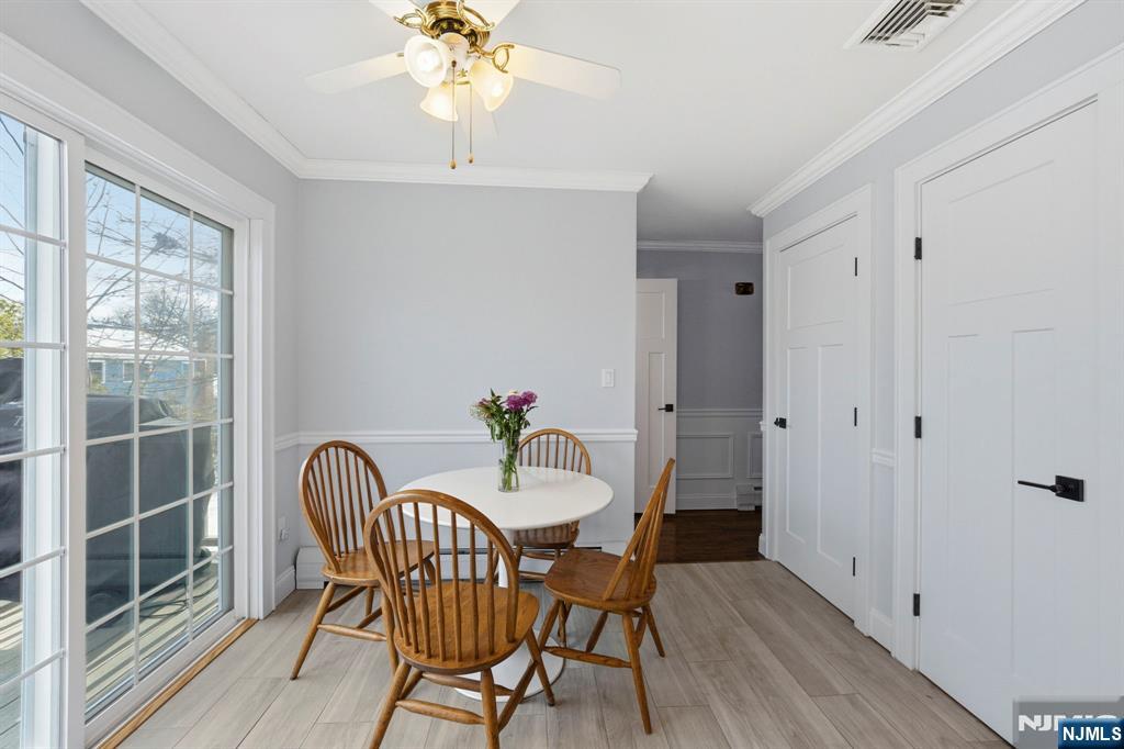 18 Laura Lane Park Ridge, NJ 07656 - Photo 16 of 36 a view of a dining room with furniture and wooden floor