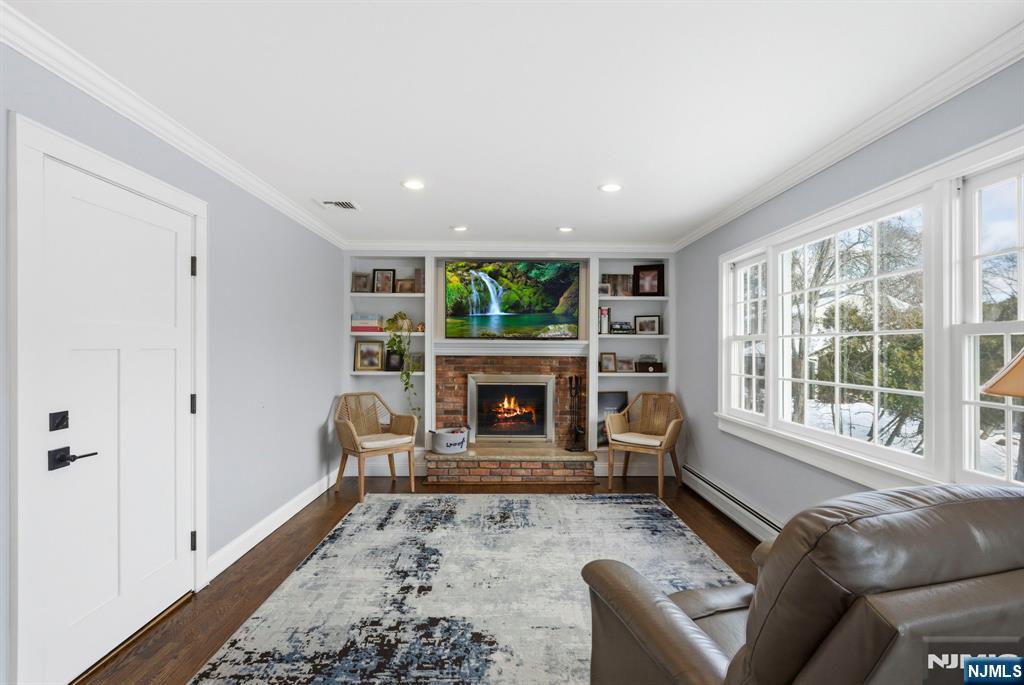 18 Laura Lane Park Ridge, NJ 07656 - Photo 18 of 36 a living room with furniture a window and a fireplace