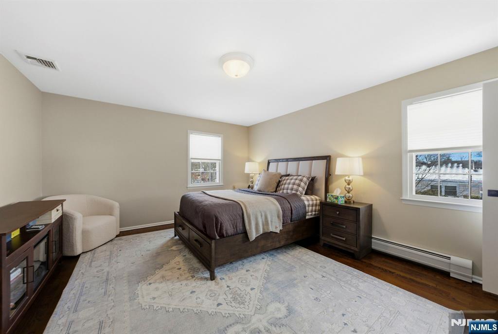 18 Laura Lane Park Ridge, NJ 07656 - Photo 23 of 36 a spacious bedroom with a bed and a window