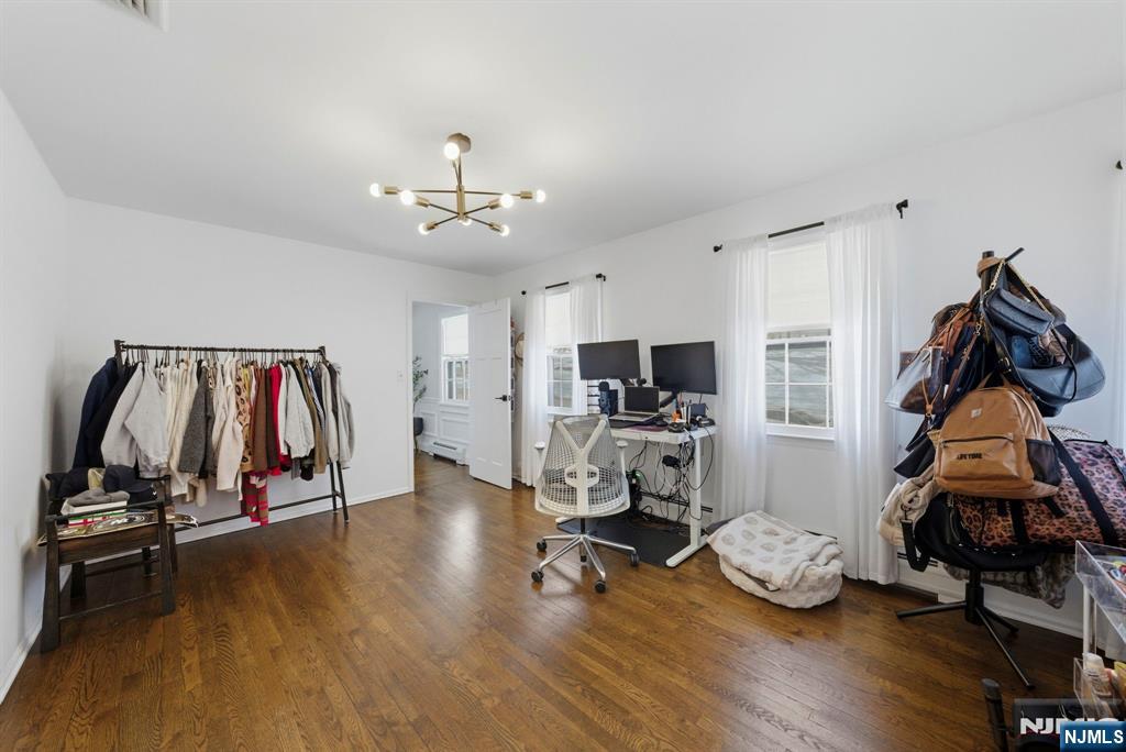 18 Laura Lane Park Ridge, NJ 07656 - Photo 34 of 36 a view of a room with wooden floor and gym equipment