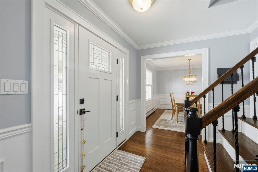 18 Laura Lane Park Ridge, NJ 07656 - Photo 5 of 36 a view of entryway with wooden floor and stairs