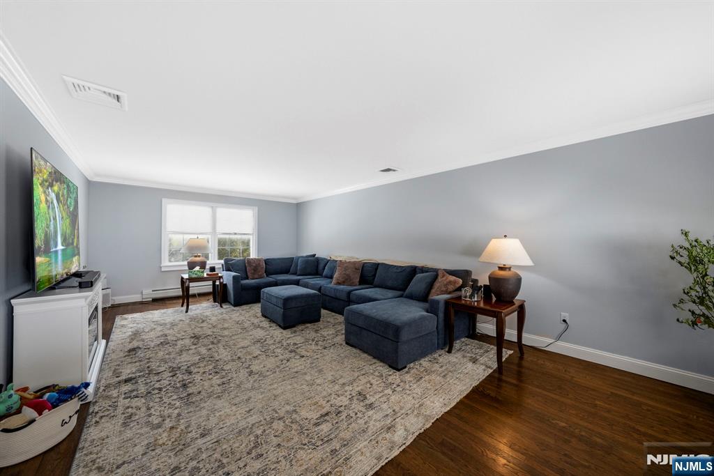 18 Laura Lane Park Ridge, NJ 07656 - Photo 7 of 36 a living room with furniture and wooden floor