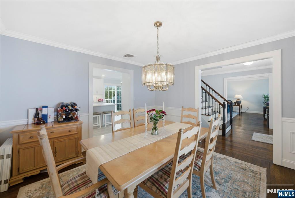 18 Laura Lane Park Ridge, NJ 07656 - Photo 10 of 36 a view of a dining room with furniture wooden floor and chandelier