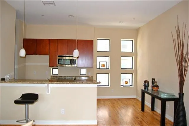 a kitchen with a sink cabinets and window