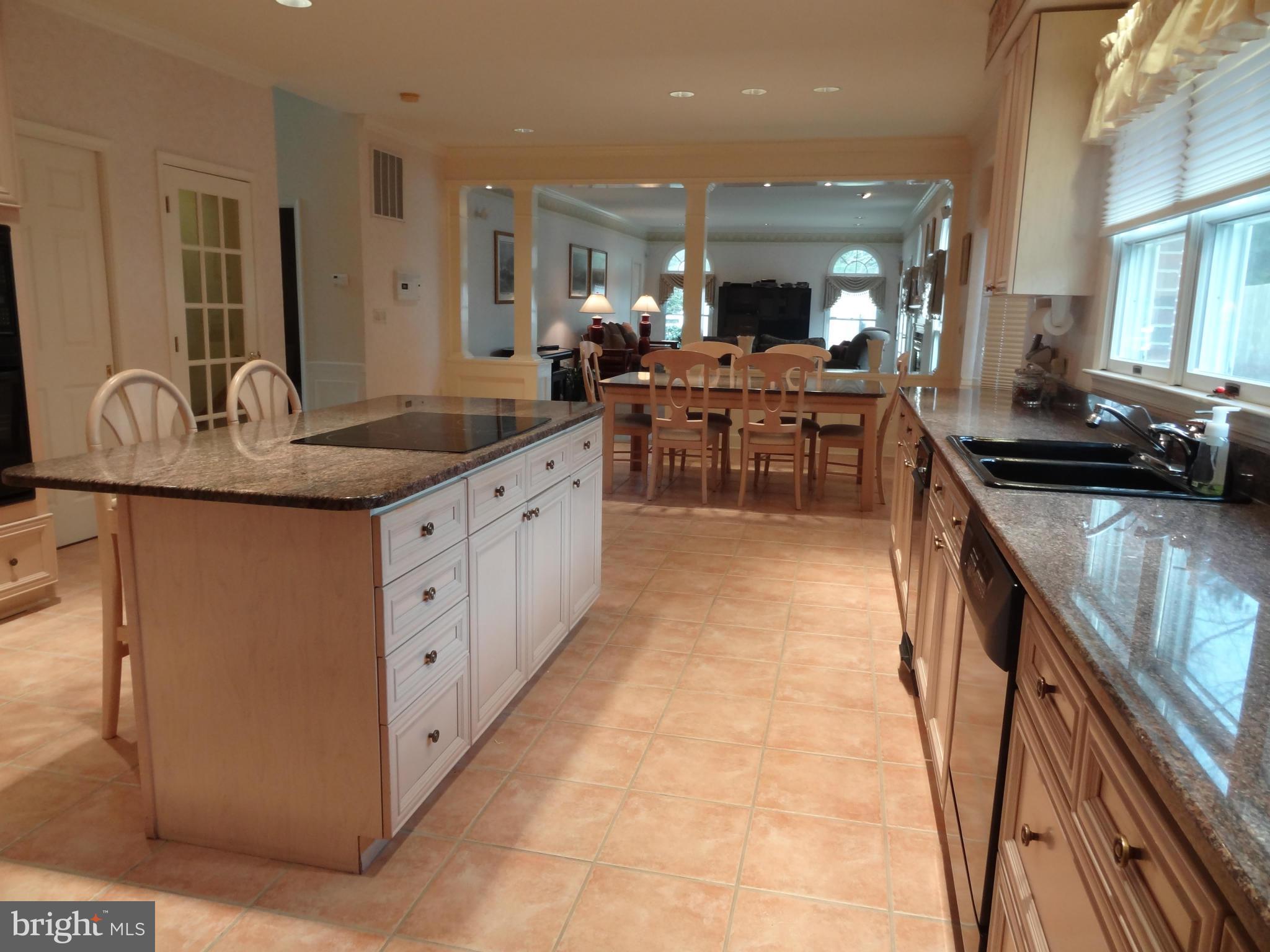491 Ferry Point Road Annapolis, MD 21403 - Photo 18 of 30 a kitchen with stainless steel appliances granite countertop a sink and cabinets