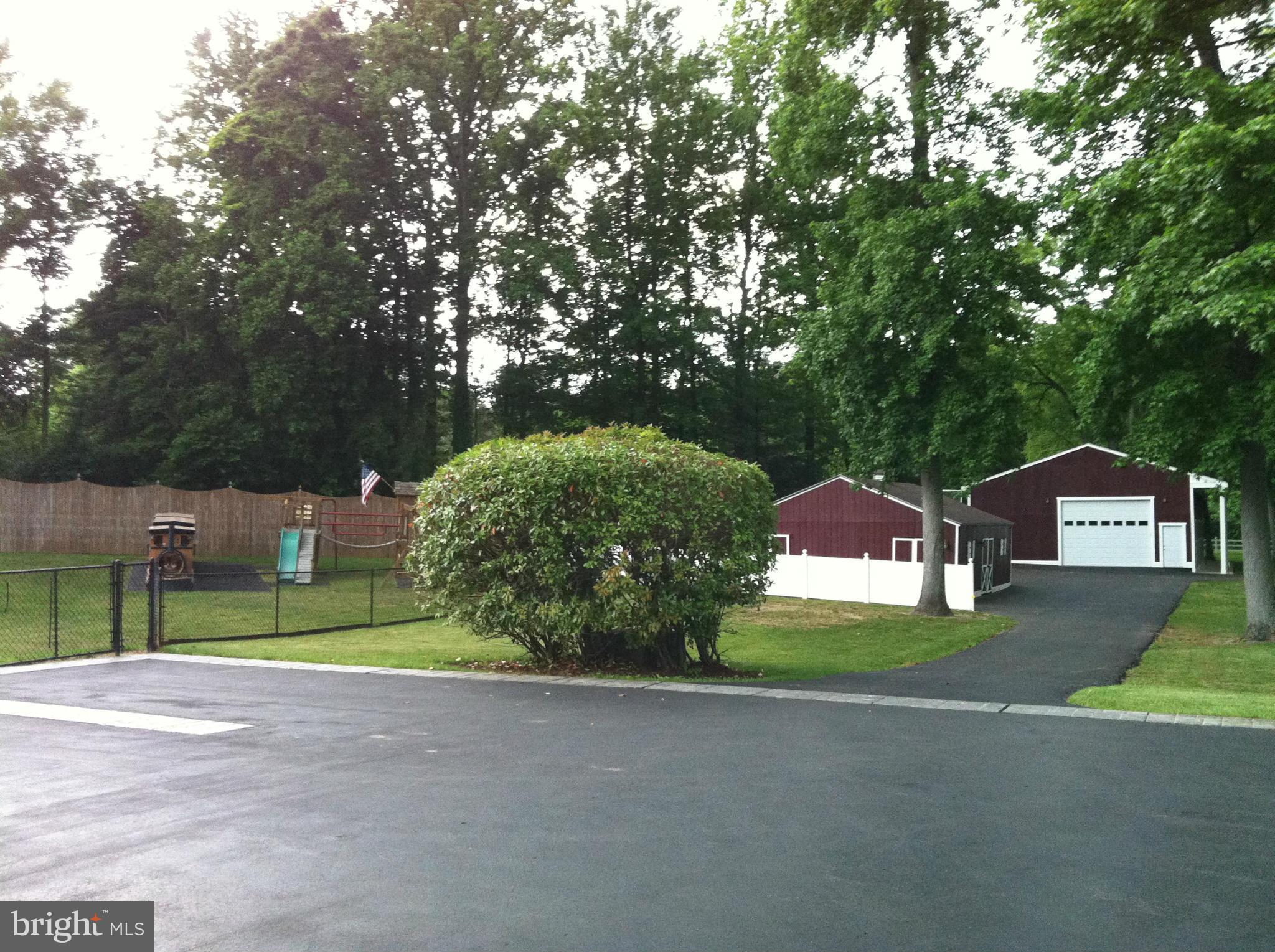 491 Ferry Point Road Annapolis, MD 21403 - Photo 25 of 30 a view of backyard of house and car parked