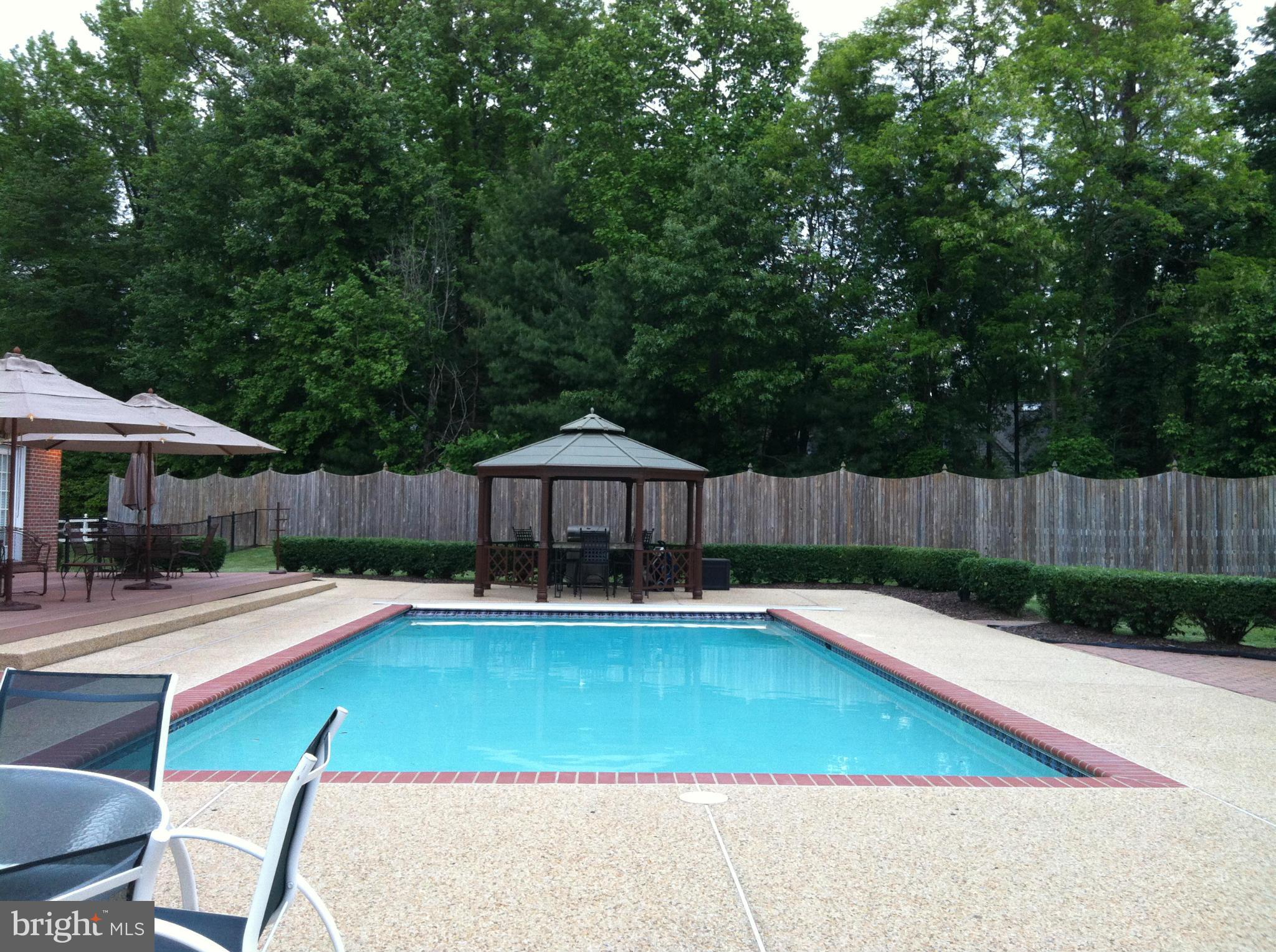 491 Ferry Point Road Annapolis, MD 21403 - Photo 4 of 30 a view of a patio with swimming pool table and chairs