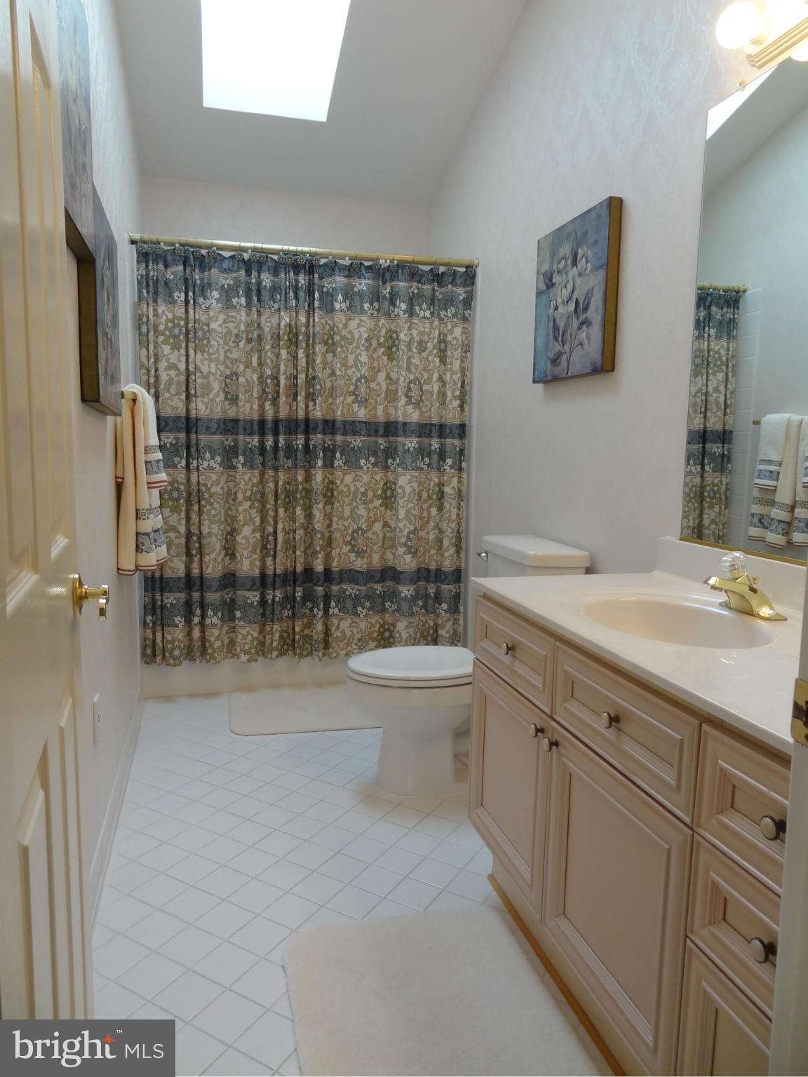 491 Ferry Point Road Annapolis, MD 21403 - Photo 10 of 30 a bathroom with a double vanity sink toilet and shower