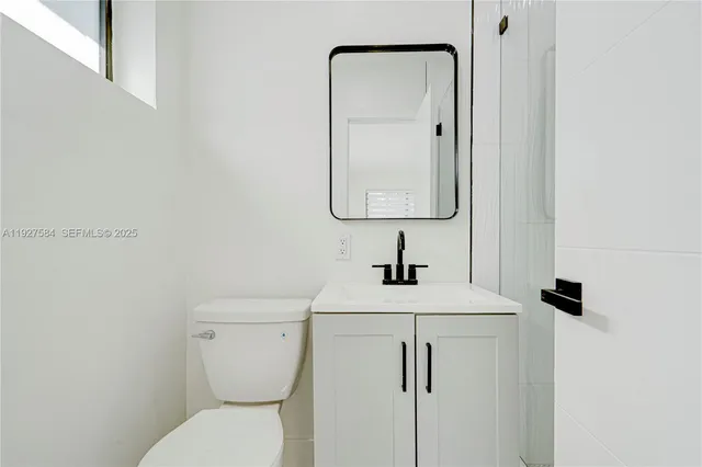 a view of a hallway with wooden shelves