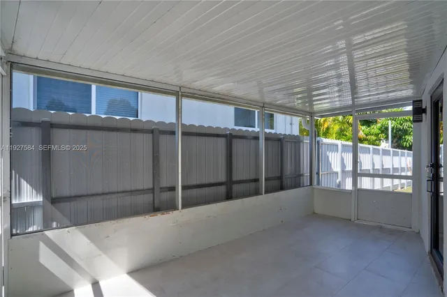 a front view of a house with a yard and green space